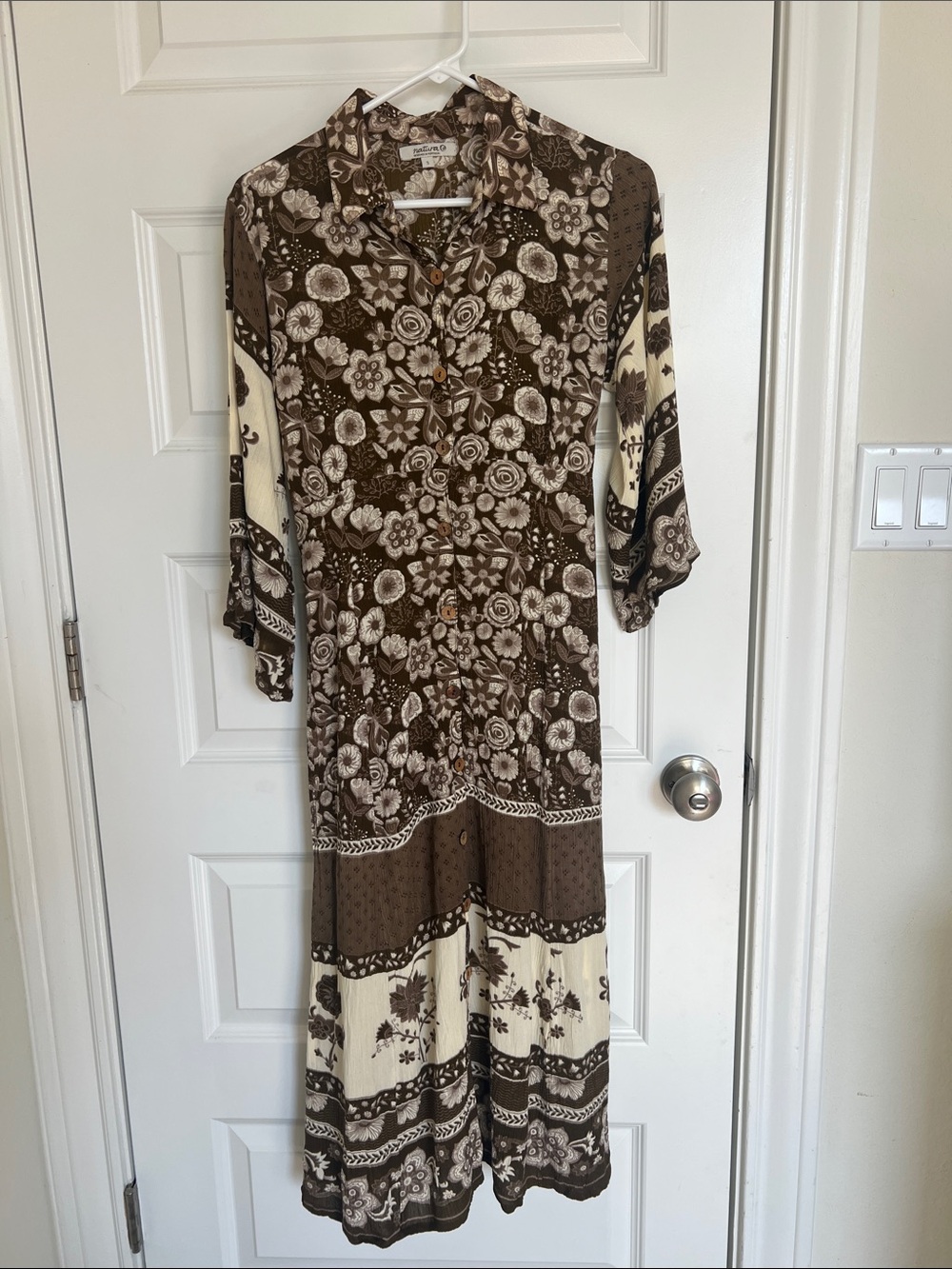 Vintage-Inspired Brown and Cream Floral The Natura Invicta dress measures 50 inc